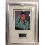 A framed & glazed signed photograph of George Clooney with COA