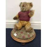 A vintage mohair bear on stool
