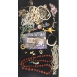 A quantity of vintage dress jewellery to inc necklaces,