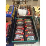 Two boxes of diecast buses etc