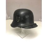A rare Third Reich SS Helmet, DRGM manufacture "Droop Bill" style, re-fitted with an M31 liner,