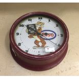 A clock advertising Esso