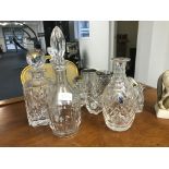 Waterford dolphins; together with crystal decanters, Doulton, Baccarat,