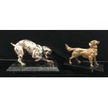 Two signed bronze dogs on a marble base