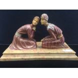 Art Nouveau resin figures of a kneeling couple