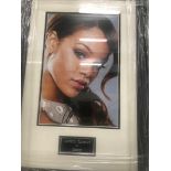 A framed & glazed signed photograph of Rihanna