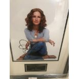 A framed & glazed signed photograph of Julia Roberts with COA