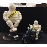 A seated Michelin Man on motorbike