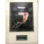 A framed and glazed signed photograph of Garth Brooks