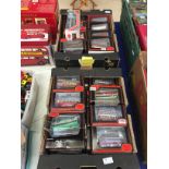 Two boxes of diecast buses etc