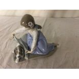 A Lladro figure (No 5688) of a girl covering her dog with a blanket