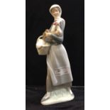 A Lladro girl with chicken and basket