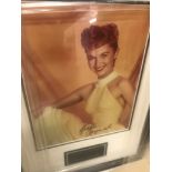 A framed & glazed signed photograph of Debbie Reynolds with COA