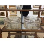 Two large cut glass cake storage lidded dishes