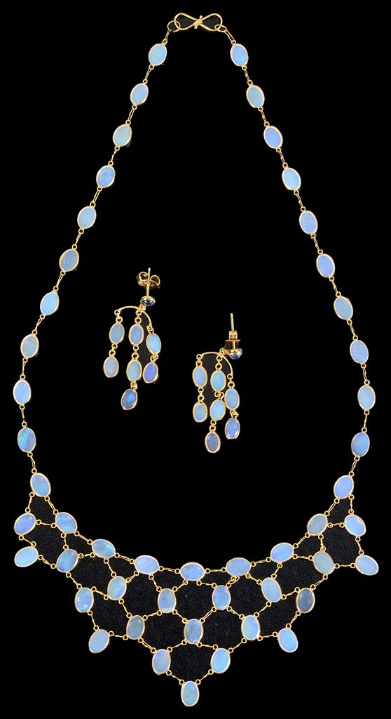 A 14K Opal Necklace and Sapphire and Opal Earrings: Post earrings set with a sapphire to the top