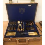 A cased gold-plated canteen of cutlery