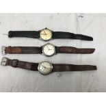 Three vintage watches: two Garrards and a Roamer: engravings to the back