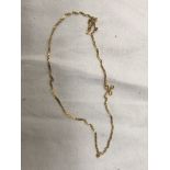 An Indian gold necklace CONDITION REPORT: Unmarked. Weight: 4.