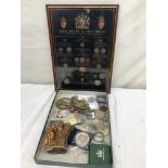 A tray of coins, commemorative medallions,
