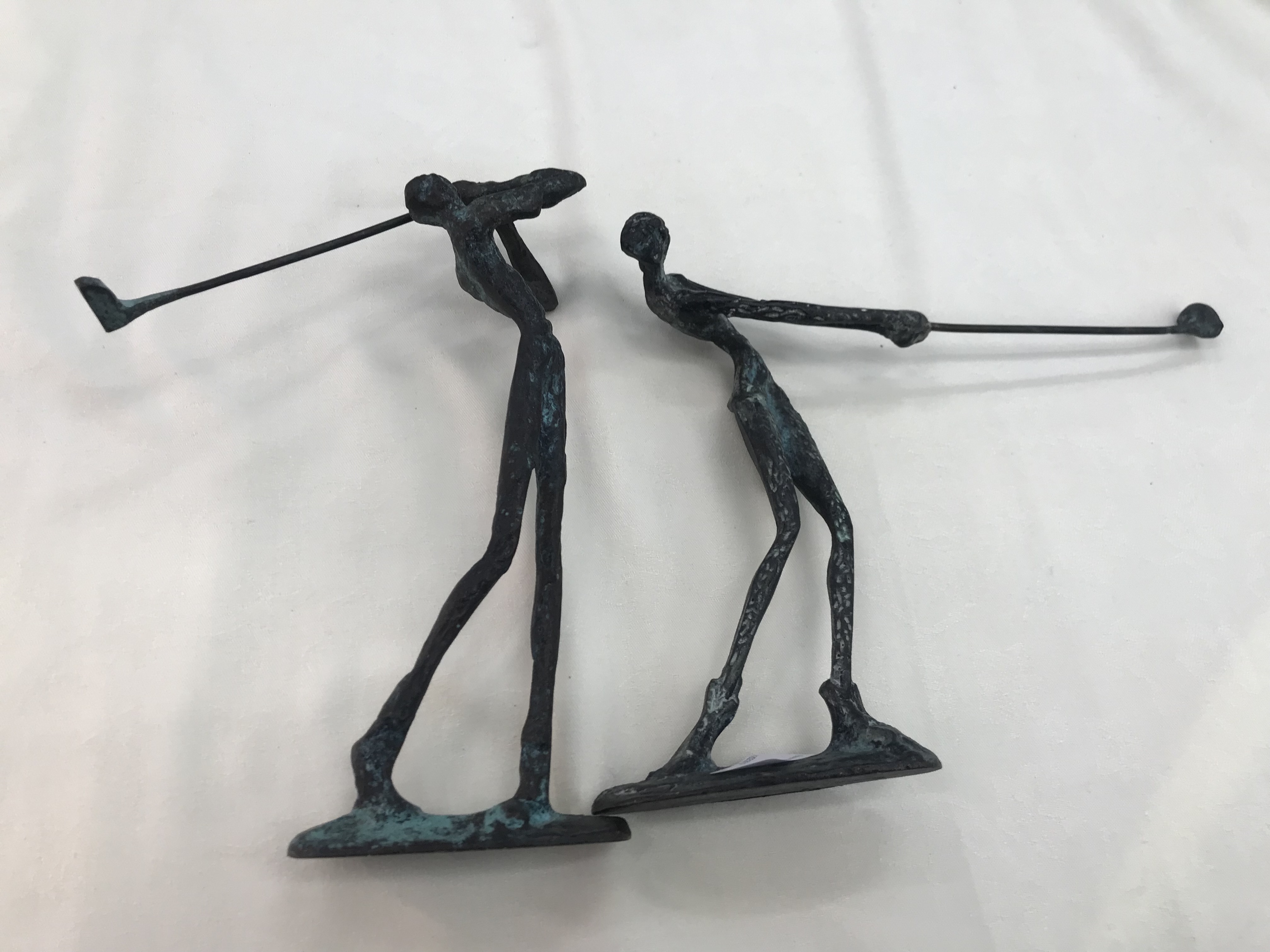 Two bronze golfing figures