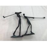 Two bronze golfing figures