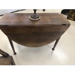 An 18th century oak drop leaf table