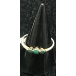 A gold and turquoise dress ring