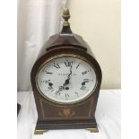 An arch case clock by O Dot Comitti with thistle inlay, sides with pierced fretwork,