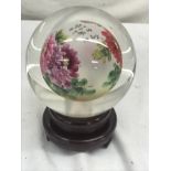 An Oriental-style crystal ball on stand