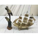 A horn carved ship and birds