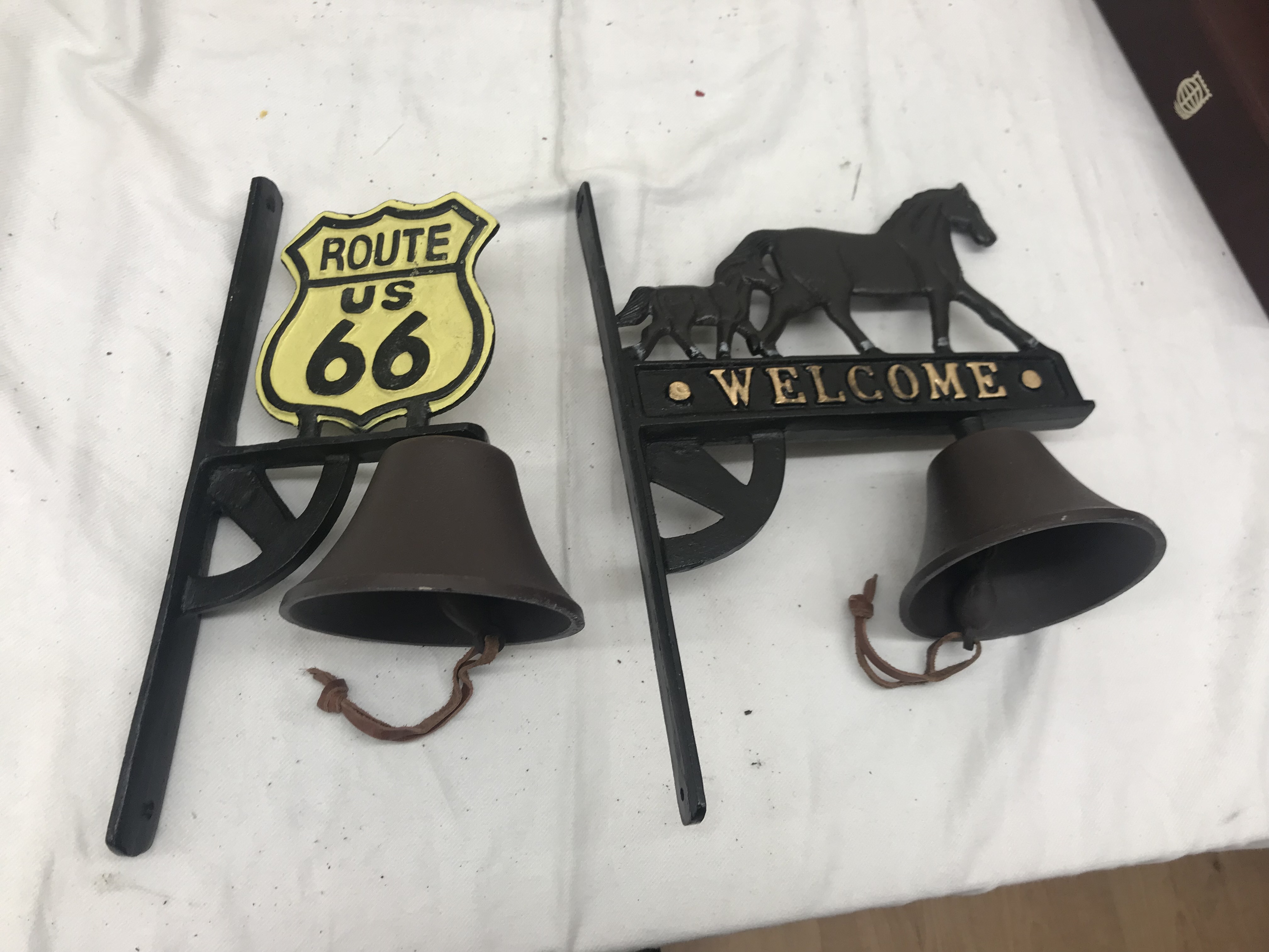 A cast-iron Route 66 bell together;