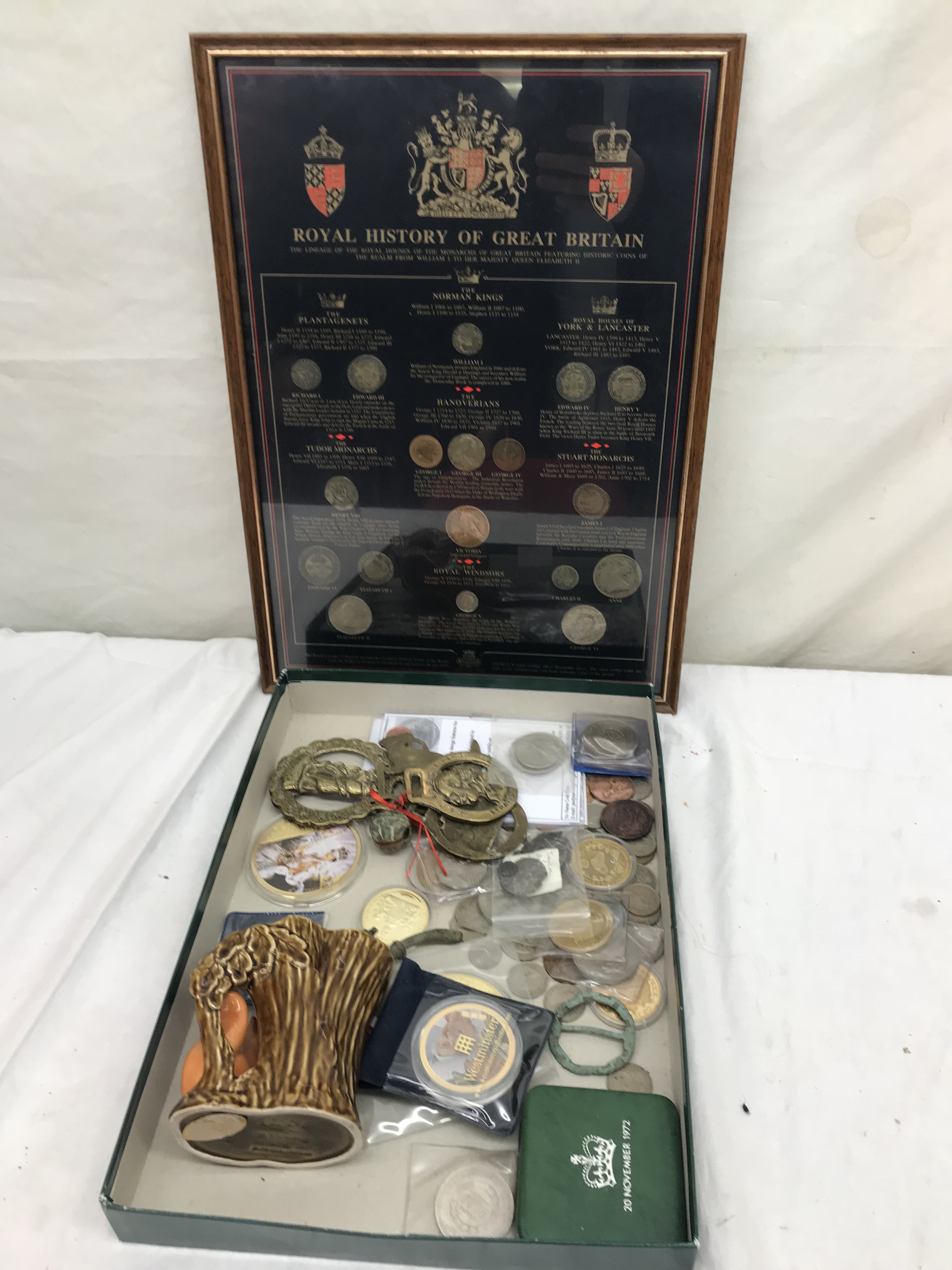 A tray of coins, commemorative medallions,