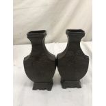 A pair of Oriental bronze vases