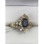 An 18ct diamond and sapphire dress ring; together with a large oval cut quality sapphire,