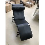 A Le Corbusier lounger in black leather