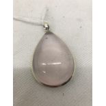 A silver rose quartz pendant
