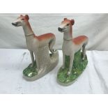 A pair of Staffs-style greyhound figures