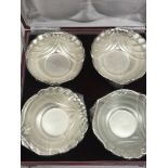 A cased Indian silver set of four bowls