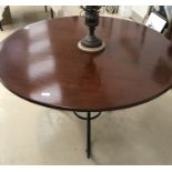 A cherrywood circular table