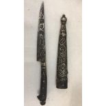 An Eastern dagger with silver inlay & scabbard