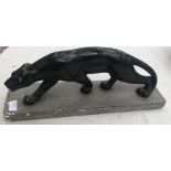 A plaster figure of a Jaguar