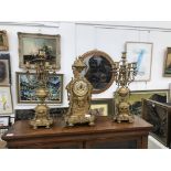 A Victorian gilt clock garniture