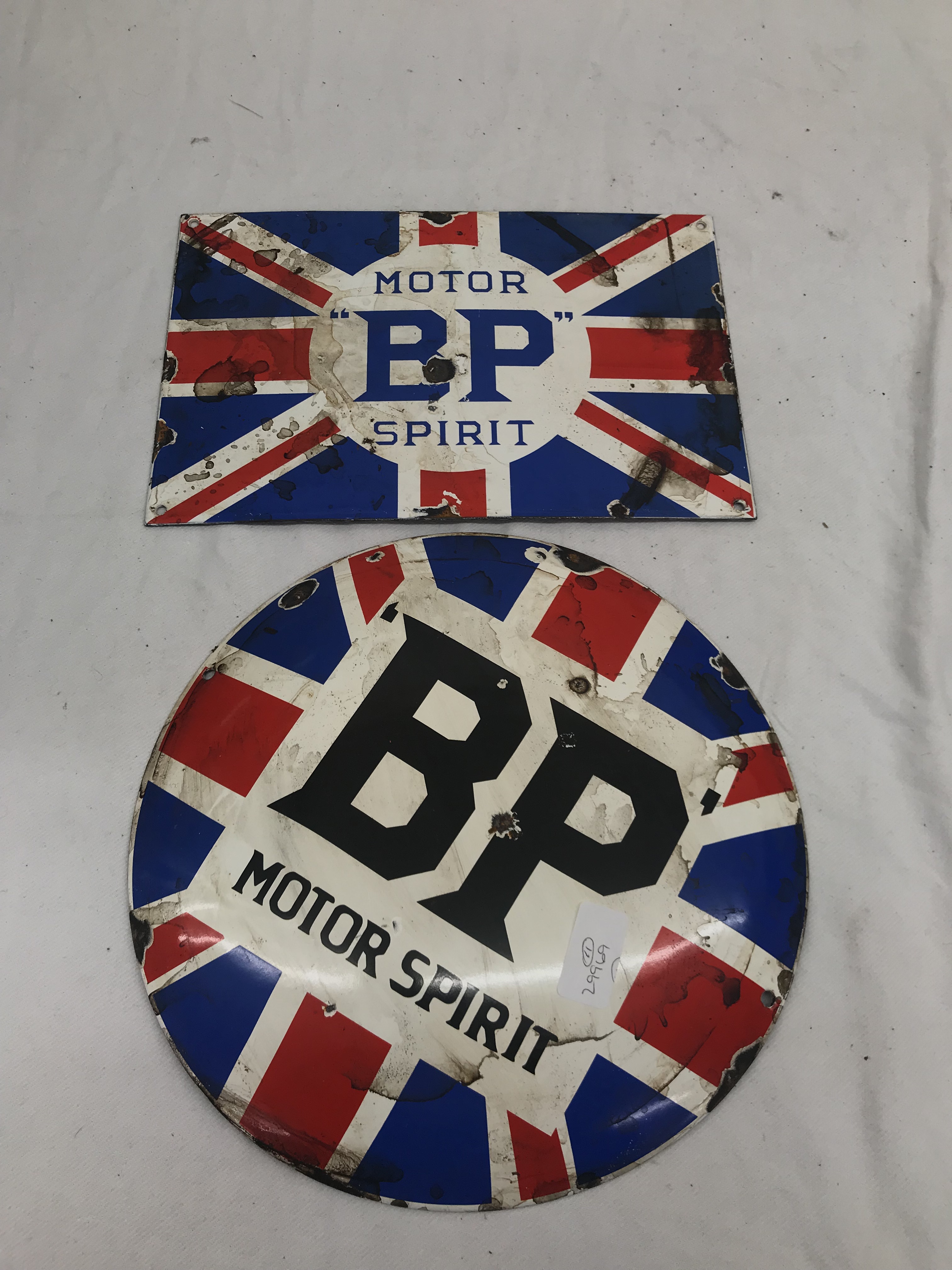 Two enamel BP Motor Oil signs