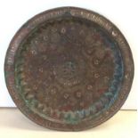 An early Islamic bronze tray with silver inlay: 40cm diameter
