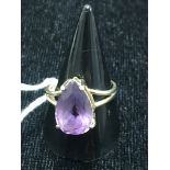 A 10k pear cut amethyst ring