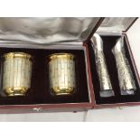 Cased Indian silver cups;