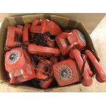 A box of vintage telephones