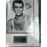 A framed & glazed signed photograph of Tony Curtis