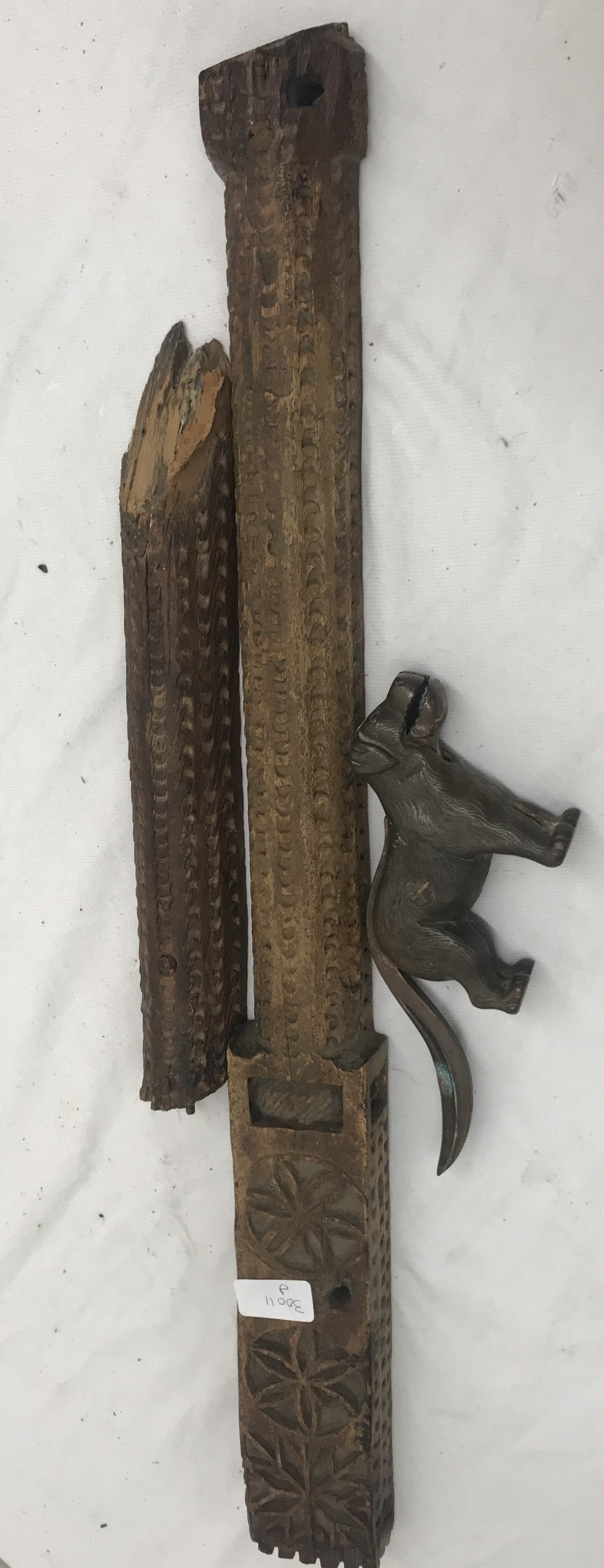 A 19th century metal dog nutcracker and a bull's head can opener;