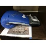 A signed blue Lonsdale boxing glove by Ken Buchanan World Heavyweight Champion with CoA - World